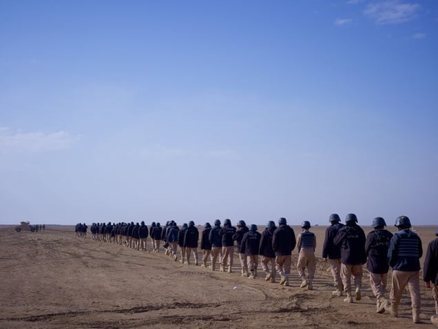 Afghan police trainees being taken to the firing ranges by US Marines, Camp Leatherneck, Helmand. © Simon Norfolk.