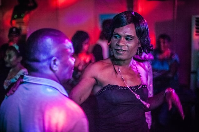 Mike "Marbelline" from Hanuabada dances with a man during a gay night party at Pacific Leisure nightclub in Port Moresby.