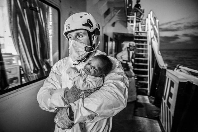 MOAS search and rescue team with rescued new born baby
