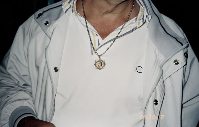 Forcella, Naples.
Annalisa Durante's necklace around the neck of Giovanni Durante (her father). Since the day she died Giovanni Durante brings breakfast with milk at 9 every morning to his daughter's grave.
© Valerio Spada.