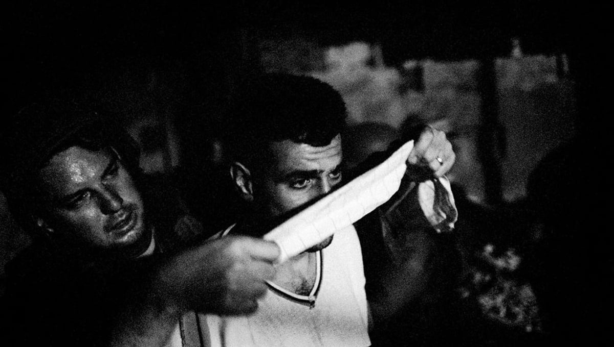 A Palestinian man is arrested and blindfolded during an Israeli army operation near Jenin, Palestine 2002 © Paolo Pellegrin