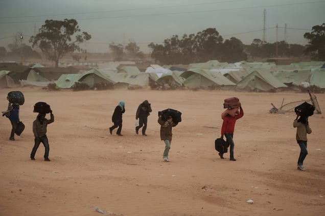 Ras Jedir, Tunisia, March 15, 2011. Refugees who had fled the civil war in Libya arriving at Choucha refugee camp. (The camp was closed in late 2013.) © Giulio Piscitelli / Contrasto / Réa