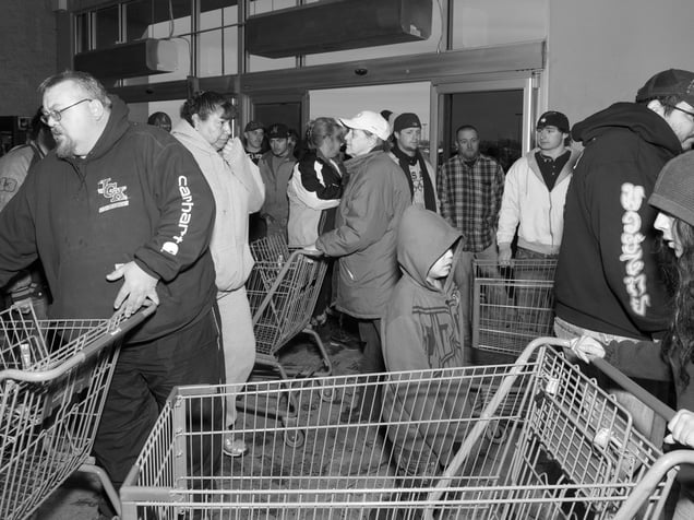 USA. Williston, ND. 2012. Customers waiting for Walmart to open on a Sunday afternoon.