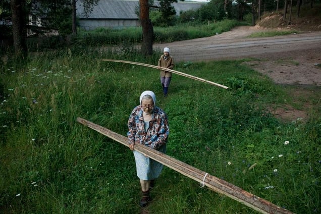 Planks for a New Fence, Russia, 2009. From the series "Alekhovshchina: Two Sisters" © Nadia Sablin