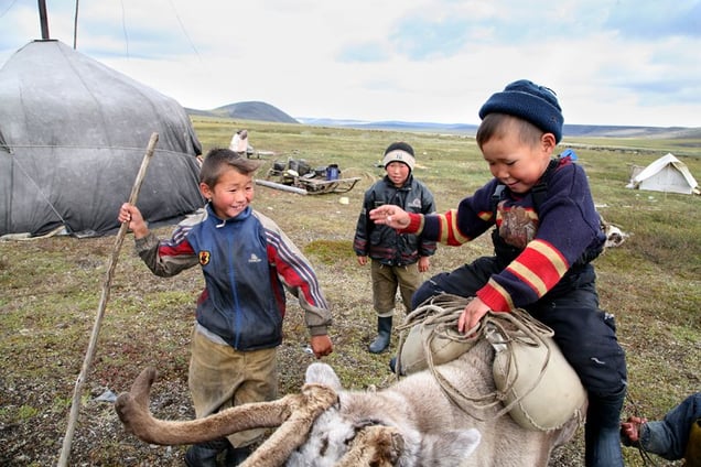 Boys learn to ride a reindeer. Bulunskiy ulus. August, 2008 © Evgenia Arbugaeva