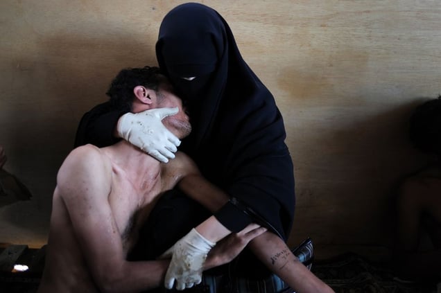 World Press Photo of the Year 2011: © Samuel Aranda, Spain, for The New York Times. Sanaa, Yemen, 15 October. A woman holds a wounded relative during protests against president Saleh.