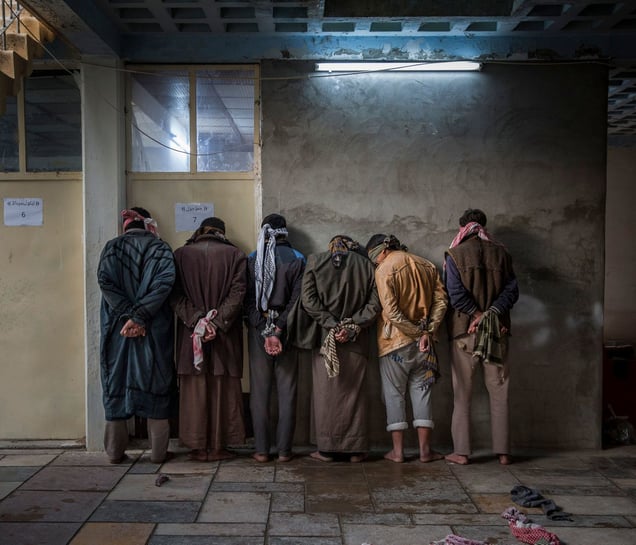 "Iraqi men from the Hawija region of Iraq wait to be questioned by Kurdish security personnel at a base near Kirkuk. Having fled areas still under the control of ISIS militants, men and boys of fighting age are vetted for any links to the group before being allowed to join their families in camps for displaced people in the Kurdish-controlled region of the country".